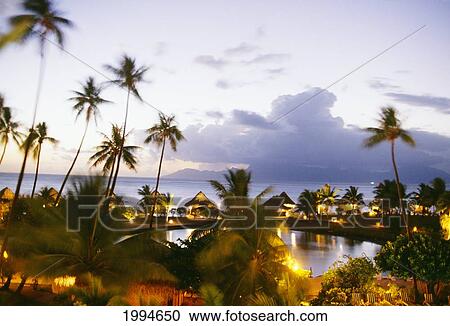 French Polynesia, Tahiti, Overview Of Hotel Sofitel Maeva Beach At Dusk View Large Photo Image Stock Image - French Polynesia, Tahiti, Overview Of Hotel Sofitel Maeva Beach At Dusk. Fotosearch