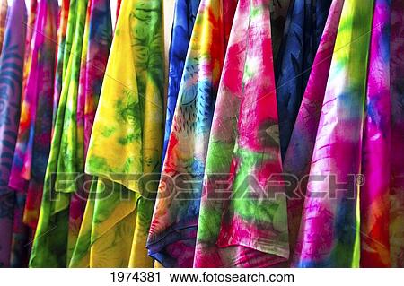 Stock Image - French Polynesia, Tahiti, Papeete, Closeup Of Many Colorful Pareos For Sale At Market. Fotosearch