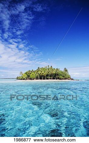 Stock Photo - French Polynesia, Tahiti, Turquoise water and blue sky; Bora Bora, Motu Island in Distance. Fotosearch