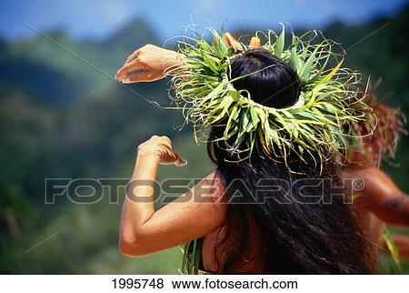 French Polynesia, Tahiti, View From Behind Tahitian Woman Dancing Outdoors, Arms Raised, Wearing Haku On Head View Large Photo Image Stock Photo - French Polynesia, Tahiti, View From Behind Tahitian Woman Dancing Outdoors, Arms Raised, Wearing Haku On Head. Fotosearch