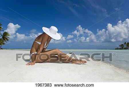 French Polynesia, Tuamotu Islands, Rangiroa Atoll, Woman Sitting On White Sand Beach. View Large Photo Image Stock Image - French Polynesia, Tuamotu Islands, Rangiroa Atoll, Woman Sitting On White Sand Beach.. Fotosearch