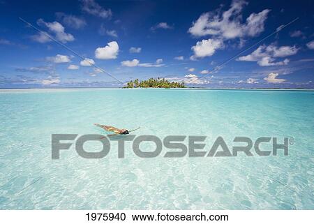 Stock Image - French Polynesia, Tuamotu Islands, Rangiroa, Woman Enjoy A Day In The Ocean.. Fotosearch