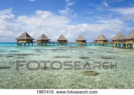 Stock Photography - French Polynesia, Tuamotu Islands, Rangiroa Atoll, Luxury Resort Bungalows Over Ocean.. Fotosearch