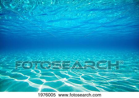Stock Photography - French Polynesia, Underwater Sandy Bottom And Surface Reflection.. Fotosearch