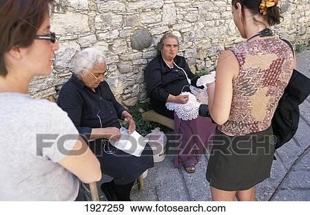 French Tourists Buy Lace From Locals In The Attractive Wine Village Of Omodos In Troodos Mountains View Large Photo Image Stock Photo - French Tourists Buy Lace From Locals In The Attractive Wine Village Of Omodos In Troodos Mountains. Fotosearch