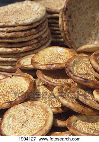 Fresh Naan Breads For Sale, Kashgar, Xinjiang, China. View Large Photo Image Stock Photo - Fresh Naan Breads For Sale, Kashgar, Xinjiang, China.. Fotosearch