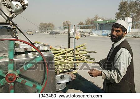 Stock Image - Fresh Sugar Cane Juice Vendor In Kabul,, Afghanistan. Fotosearch