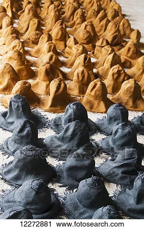 Stock Image - Freshly woven and dyed panama hats made from toquilla straw drying at the Homero Ortega Panama Hat Factory, Cuenca, Azuay, Ecuador. Fotosearch