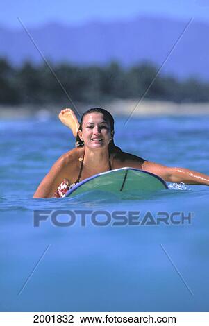 Front View Of Woman On Surfboard Paddling Out, Smiling View Large Photo Image Stock Image - Front View Of Woman On Surfboard Paddling Out, Smiling. Fotosearch