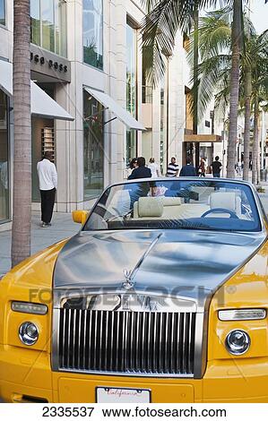Stock Photo - Front View Of Yellow Limousine; California, Usa. Fotosearch