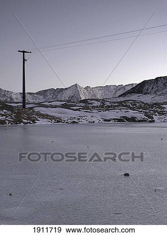 Stock Photo - Frozen Lake With Melting Snow In Gothtard Pass, Switzerland. Fotosearch