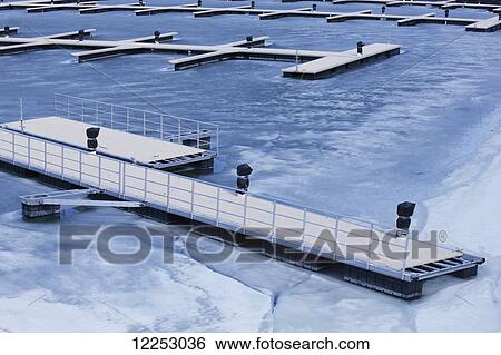Stock Photograph - Frozen piers; Montreal, Quebec, Canada. Fotosearch