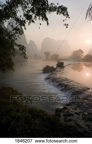 Stock Photo - Frozen Pond In Mountain Area. Fotosearch