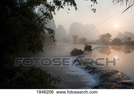 Stock Photograph - Frozen Pond In Mountain Area. Fotosearch