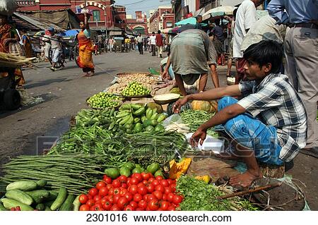 Stock Photograph - Fruit and veg for sale on street next to New Market near Sudder Street, a popular backpacker budget accommodation district of Calcutta / Kolkata, the capital of West Bengal State, India, Asia.. Fotosearch