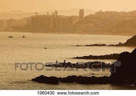 Stock Image - Fuengirola At Sunset Seen From Torremuelle; Torremuelle, Malaga Province, Costa Del Sol, Spain. Fotosearch