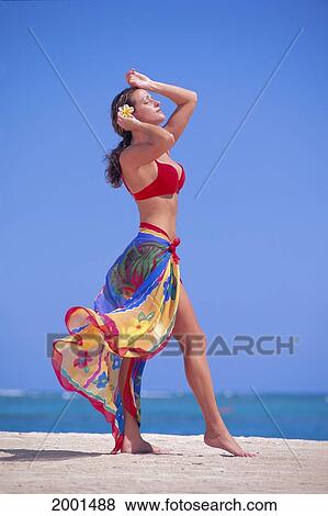 Stock Photo - Full Length View Woman In Red Bikini With Colorful Pareo Beach, Blue Skies. Fotosearch
