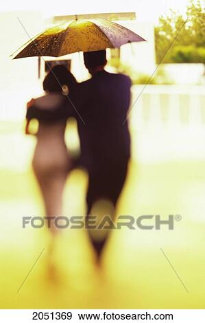 Fv2416, Madcow; Man And Woman Walk Away Under Umbrella View Large Photo Image Stock Photo - Fv2416, Madcow; Man And Woman Walk Away Under Umbrella. Fotosearch