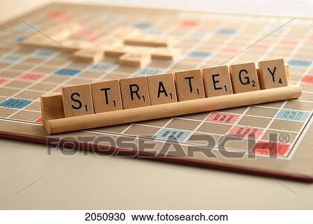 Stock Image - Fv5494, Isabelle Schnoekel; Strategy Spelled Out In Scrabble Letters On Scrabble Board. Fotosearch