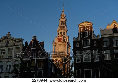 Gabled houses and spire of the Zuiderkerk at dusk; Amsterdam, Holland View Large Photo Image Picture - Gabled houses and spire of the Zuiderkerk at dusk; Amsterdam, Holland. Fotosearch