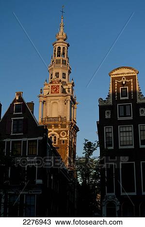 Gabled houses and spire of the Zuiderkerk at dusk; Amsterdam, Holland View Large Photo Image Stock Image - Gabled houses and spire of the Zuiderkerk at dusk; Amsterdam, Holland. Fotosearch