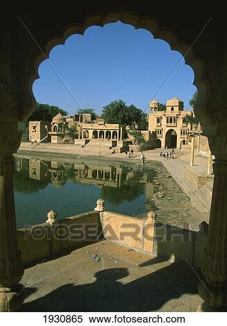 Stock Photography - Gadisar Lake and Gateway seen through scalloped arch, Jaisalmer, Rajasthan, India, Gadisar Lake and Gateway seen through scalloped arch, Jaisalmer, Rajasthan, India (c) Sue Carpenter/Axiom.. Fotosearch