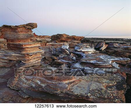 Stock Image - Gantheaume Point at sunset; Broome, Australia. Fotosearch