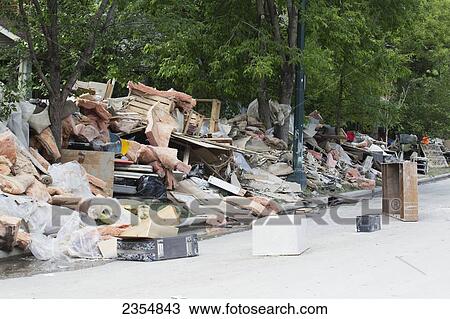 Garbage And Destroyed Household Items Piled Along The Street After A Flood; Calgary, Alberta, Canada View Large Photo Image Stock Image - Garbage And Destroyed Household Items Piled Along The Street After A Flood; Calgary, Alberta, Canada. Fotosearch