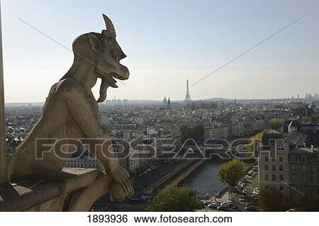 Gargoyle Overlooking Paris With The Seine River And The Eiffel Tower In The Background; Paris, France View Large Photo Image Stock Photograph - Gargoyle Overlooking Paris With The Seine River And The Eiffel Tower In The Background; Paris, France. Fotosearch