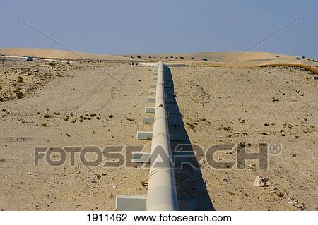 Stock Image - Gas Pipeline In Desert, Qatar. Fotosearch