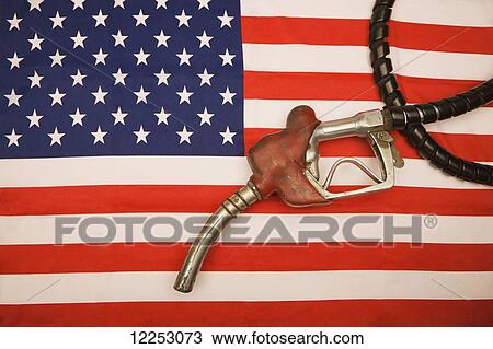 Gas pump and hose on American flag View Large Photo Image Stock Image - Gas pump and hose on American flag. Fotosearch