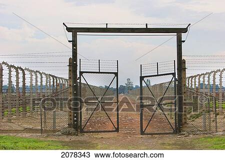 Stock Image - Gate To A Section Of The Auschwitz-Birkenau Concentration Camp, Oswiecim, Malopolska, Poland. Fotosearch