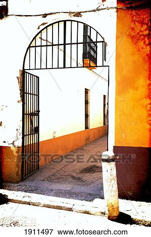 Stock Photo - Gateway To Alley In Barrio Santa Cruz, Seville, Spain. Fotosearch