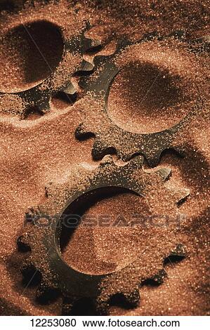 Gears covered in sand View Large Photo Image Stock Image - Gears covered in sand. Fotosearch