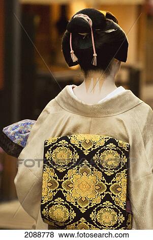 Stock Photo - Geisha Showing Her Nape Make-Up And Obi; Kyoto, Japan. Fotosearch