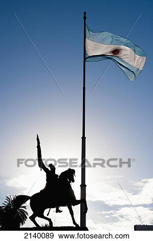 Stock Photo - General Belgrano's Statue And National Flag, Buenos Aires, Argentina. Fotosearch