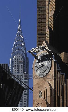 Stock Image - General Electric Building's Art Deco Detailing And Chrysler Building. Fotosearch