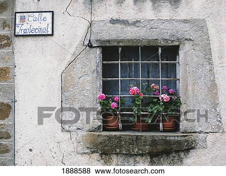 Stock Photo - Geraniums In Window Of Old House In The Village Of Torla. Fotosearch