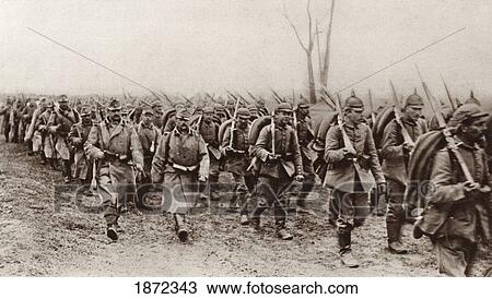Stock Image - German And Austrian Soldiers Marching Shoulder To Shoulder Against The Russians During World War I. From The Illustrated War News 1915.. Fotosearch