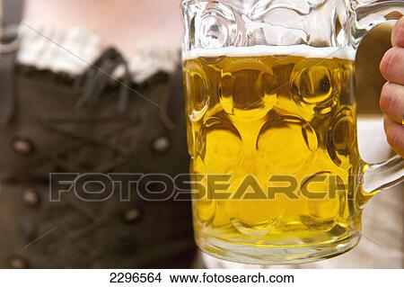 Picture - Germany, Bavaria, Couple in traditional Lederhosen at beer festival; Ortenburg. Fotosearch