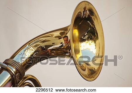 Stock Image - Germany, Bavaria, Man playing tuba at wedding; Ortenburg. Fotosearch