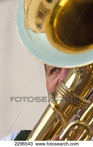 Stock Image - Germany, Bavaria, Man playing tuba at wedding; Ortenburg. Fotosearch