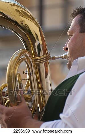Stock Photo - Germany, Bavaria, Man playing tuba at wedding; Ortenburg. Fotosearch