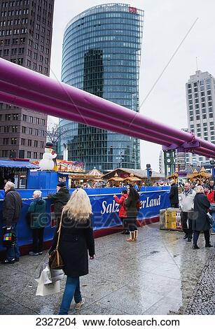 Germany, Berlin, Giant purple utility pipes go overhead Christmas Market; Potsdamer Platz Berlin View Large Photo Image Picture - Germany, Berlin, Giant purple utility pipes go overhead Christmas Market; Potsdamer Platz Berlin. Fotosearch