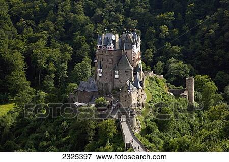 Stock Photo - Germany, Burg Eltz; Rheinland-Pfalz, Pedestrians walking up road to Eltz castle. Fotosearch