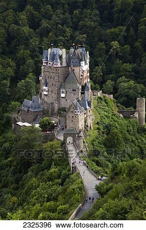 Germany, Burg Eltz; Rheinland-Pfalz, Pedestrians walking up road to Eltz castle View Large Photo Image Stock Photograph - Germany, Burg Eltz; Rheinland-Pfalz, Pedestrians walking up road to Eltz castle. Fotosearch