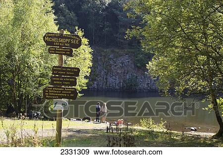 Germany, Kaufungen, View of artificial lake; Michelskopfsee View Large Photo Image Stock Photo - Germany, Kaufungen, View of artificial lake; Michelskopfsee. Fotosearch