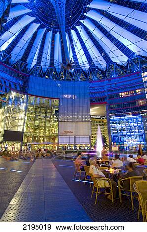 Germany, People eating out in cafe at night in Sony Centre; Berlin View Large Photo Image Stock Photo - Germany, People eating out in cafe at night in Sony Centre; Berlin. Fotosearch