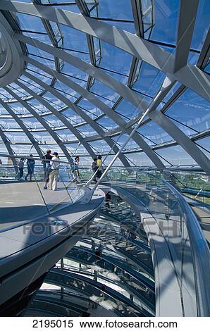 Stock Photography - Germany, People inside top of dome of Reichstag (architect: Sir Norman Foster); Berlin. Fotosearch