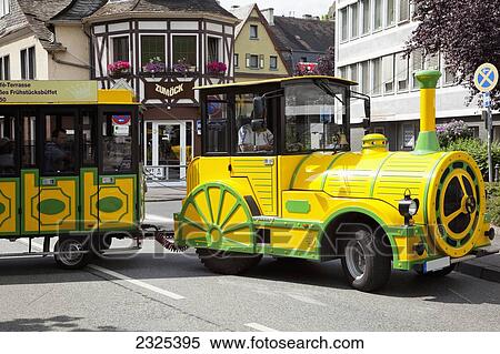 Germany, Rheinland-Pfalz, Bright yellow and green tour train in street; Cochem View Large Photo Image Stock Photography - Germany, Rheinland-Pfalz, Bright yellow and green tour train in street; Cochem. Fotosearch